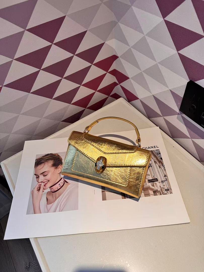 bvlgari-5029-top-handle-bag-metallic-gold-20-cm-1.jpg Bvlgari 5029 Top Handle Bag – Metallic Gold, 20 cm - Image 1