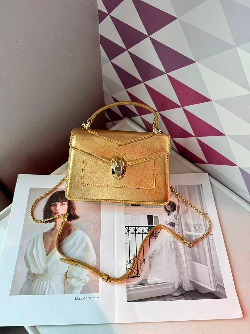 bvlgari-5083-top-handle-bag-metallic-gold-20-cm-1.jpg Bvlgari 5083 Top Handle Bag – Metallic Gold, 20 cm - Image 1